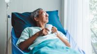 Male patient resting in bed